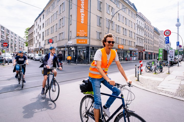 a person riding a bicycle on a city street