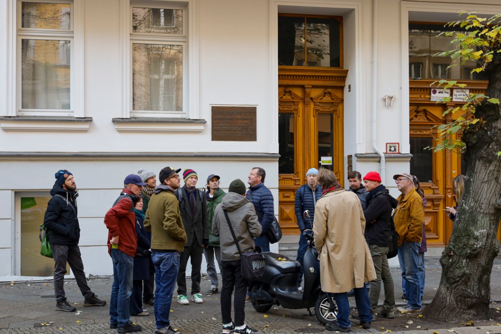 Berlin on Bike tour guides standing on front of the building where Christopher Isherwood lived in Berlin