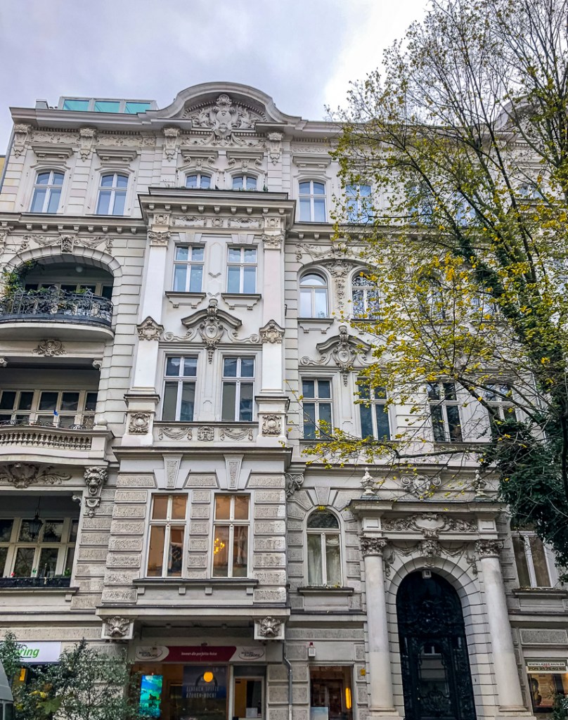 a large Berlin apartment building from the 19th century with a nice decorated facade