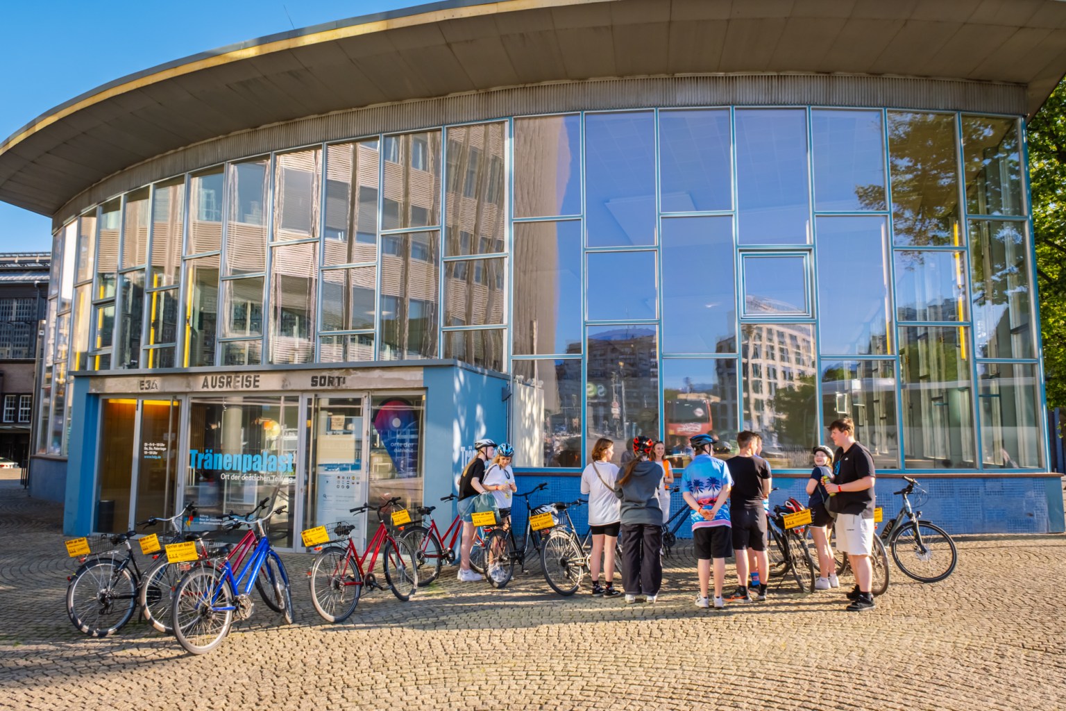 a group of people sitting at a train station