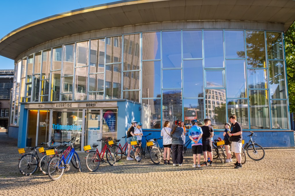 a group of people sitting at a train station