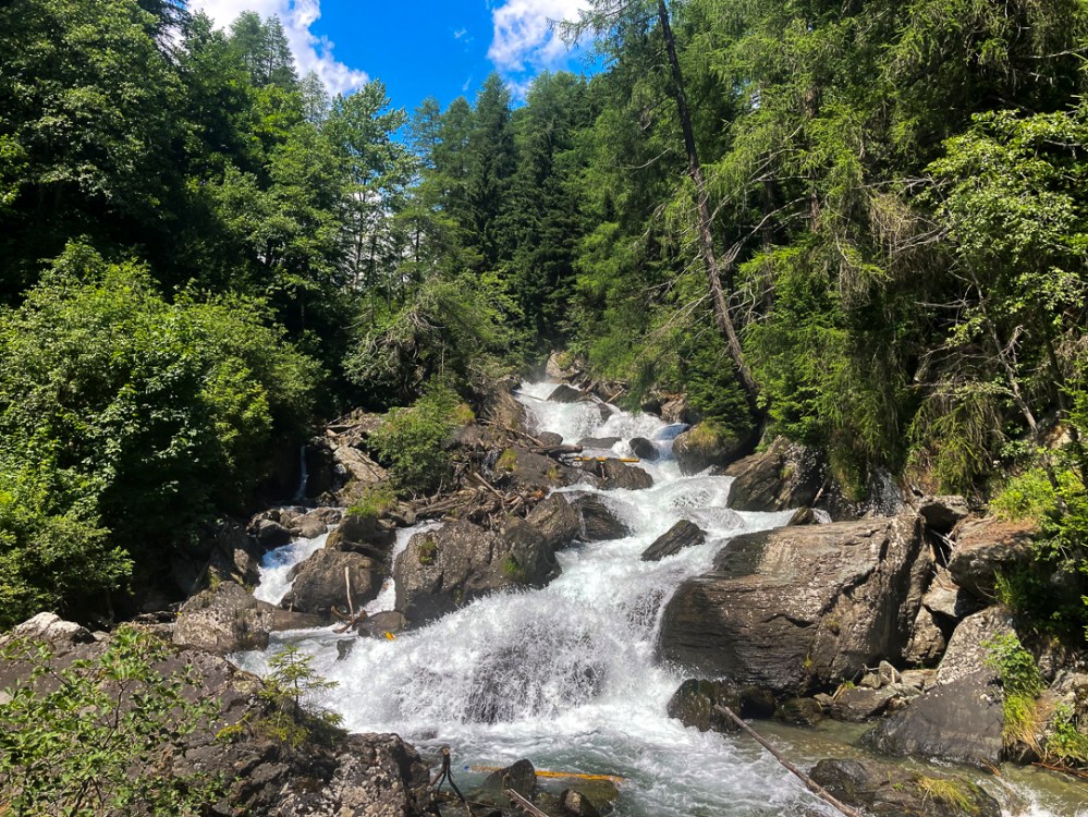 a large waterfall in a forest